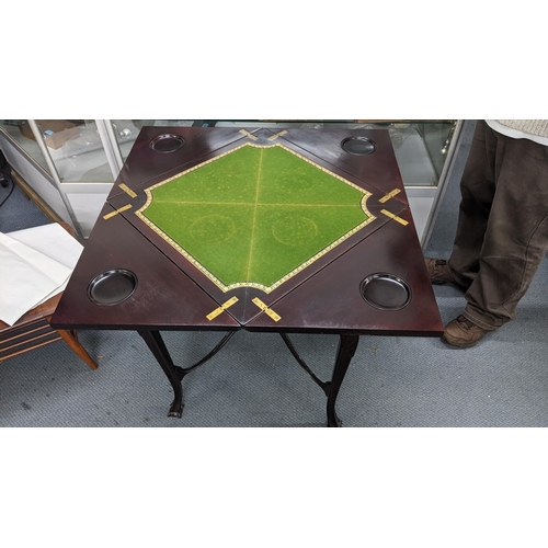 4 - A 1920's mahogany fold out envelope table on cabriole legs and lion claw feet, 71.5 h cm x 55.5cm w
... 