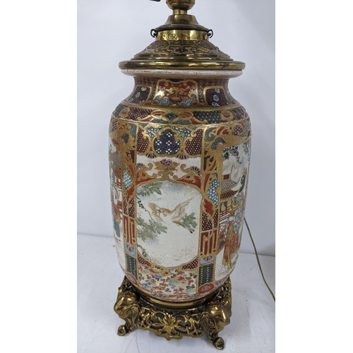 5 - A Japanese Meiji Satsuma table lamp decorated with panels of birds and figures, gilt mounts with ele... 