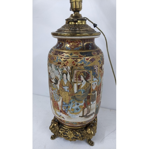 5 - A Japanese Meiji Satsuma table lamp decorated with panels of birds and figures, gilt mounts with ele... 