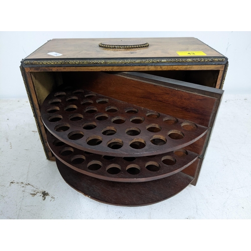 43 - A Victorian walnut cigar /pipe box, the swivel front with fitted interior and lock with key, the fro... 