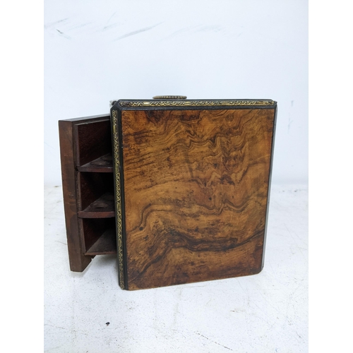 43 - A Victorian walnut cigar /pipe box, the swivel front with fitted interior and lock with key, the fro... 