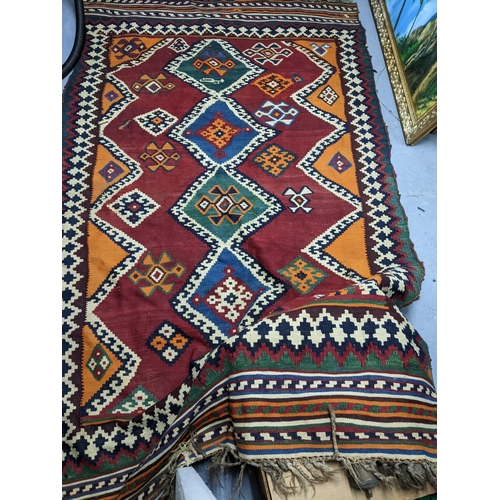 56 - A Qashqai kilim style rug 244 x 145cm
Location G
If there is no condition report shown, please reque... 