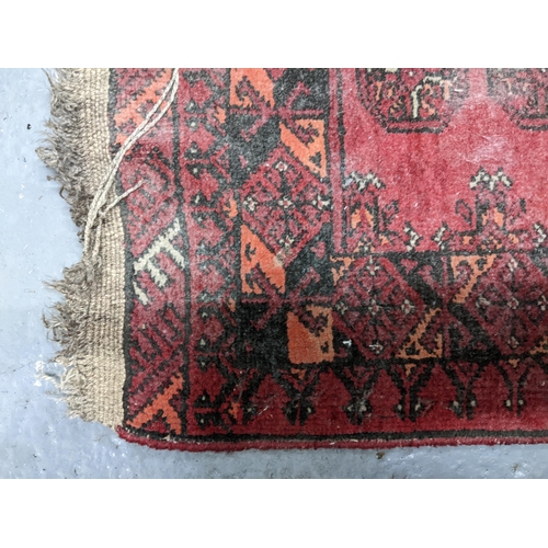 57 - A Persian hand woven red ground prayer rug
Location G
If there is no condition report shown, please ... 