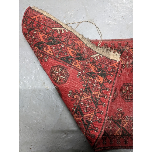 57 - A Persian hand woven red ground prayer rug
Location G
If there is no condition report shown, please ... 