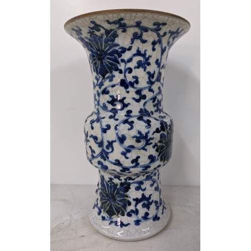 78 - A late 19th/early 20th century Chinese crackle glazed porcelain vase decorated in a blue and white f... 