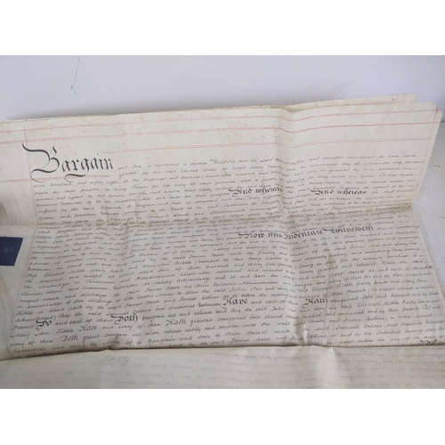 89 - Seven indentures relating to buying and selling agreements along with a modern reproduction of a map... 