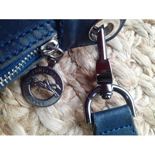 11 - Longchamp-A navy leather Pilage crossbody bag, made in Morocco, serial number partly worn on label h... 