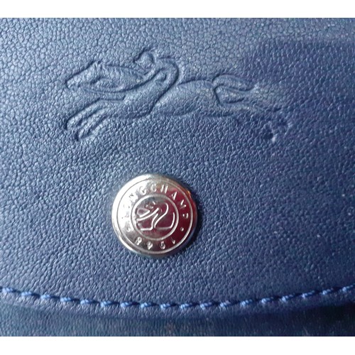 11 - Longchamp-A navy leather Pilage crossbody bag, made in Morocco, serial number partly worn on label h... 