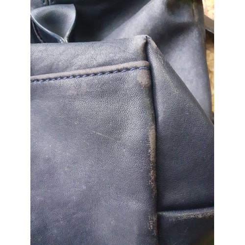 11 - Longchamp-A navy leather Pilage crossbody bag, made in Morocco, serial number partly worn on label h... 