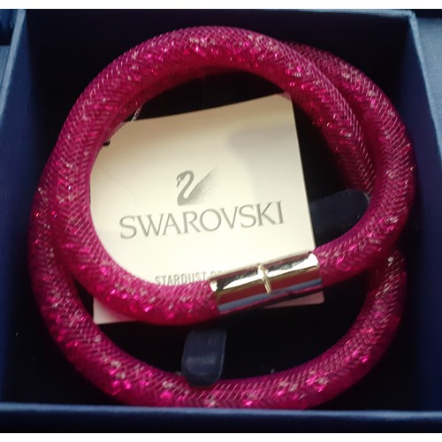 30 - Swarovski-A group of 6 boxed Stardust double bracelets in the following colours pink, copper, silver... 