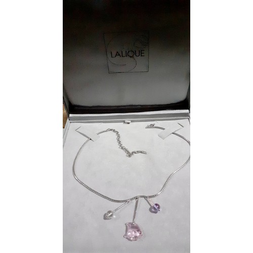 17 - Lalique- A boxed silver necklace with a pink glass fish pendant flanked by 2 glass drop pendants in ... 