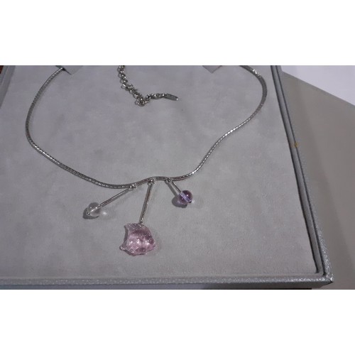 17 - Lalique- A boxed silver necklace with a pink glass fish pendant flanked by 2 glass drop pendants in ... 