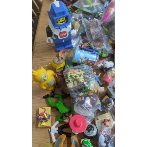 119 - A large collection of children's toys to include Lego, Tom and Jerry, Teenage Mutant Ninja Turtles, ... 