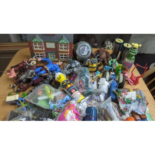 119 - A large collection of children's toys to include Lego, Tom and Jerry, Teenage Mutant Ninja Turtles, ... 