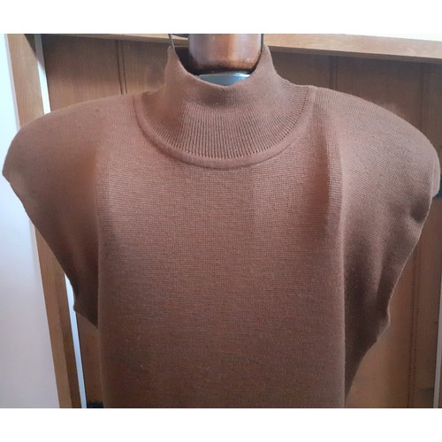 5 - Gucci- A 1980's ladies brown knitted woollen, sleeveless dress A/F, having a turtle neck, padded sho... 