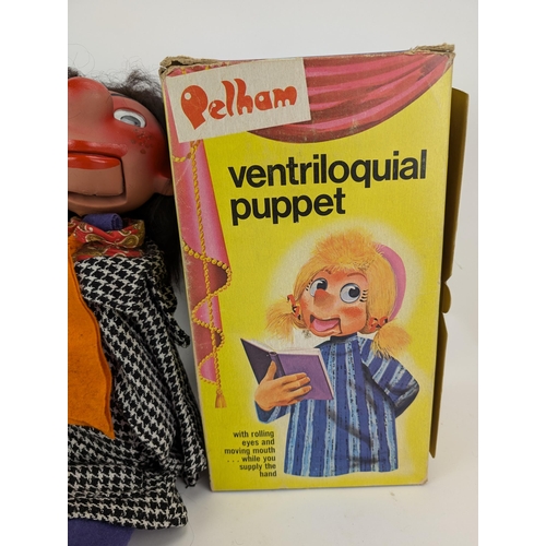 52B - A Pelham ventriloquial puppet, wearing a check jacket and blue and blue trousers, boxed

Location:7.... 