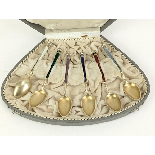 52C - A set of six succession silver gilt and enamelled coffee spoons by David Anderson, stamped 925, and ... 