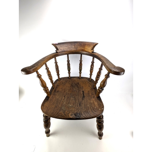 74A - An early 20th century beech and elm smokers bow chair, with a spindle back and turned legs

Location... 