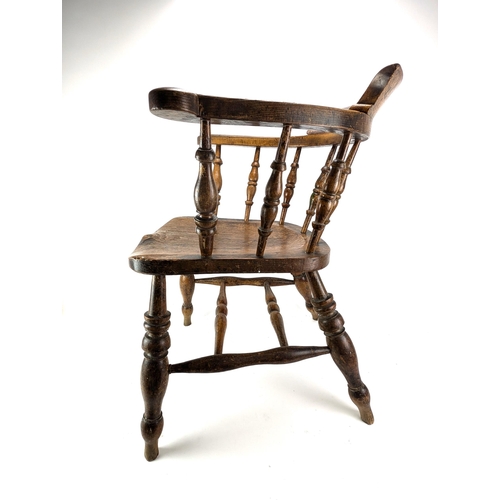 74A - An early 20th century beech and elm smokers bow chair, with a spindle back and turned legs

Location... 