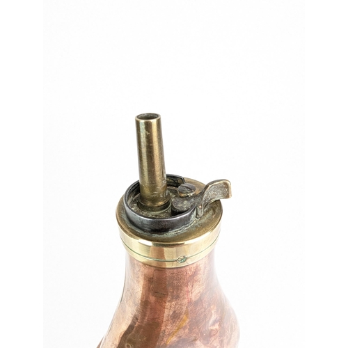 74B - A copper and brass Colt 1851 Navy type powder flask

Location:7.2
If there is no condition report sh... 