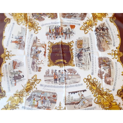 1 - Hermes- A 1970's 'Chansons de France' silk scarf designed by Phillippe Ledoux in brown, cream and go... 