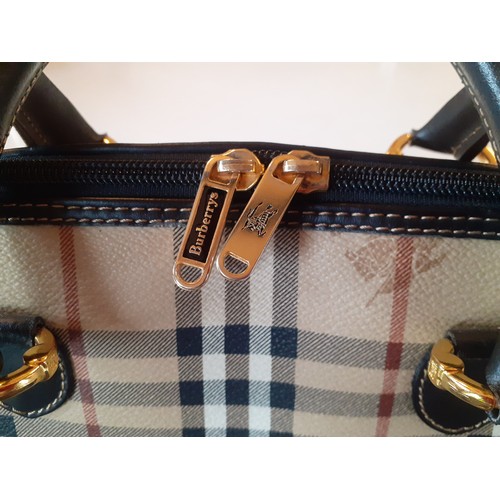 3 - Burberrys- A vintage Haymarket check and black leather Alma handbag, made in Italy, having gold tone... 