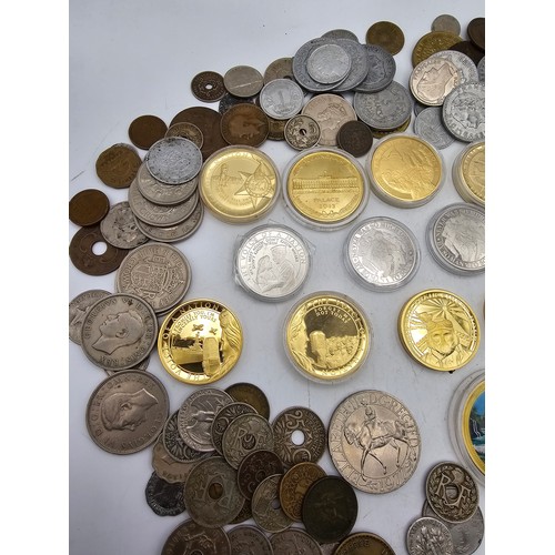 102 - A collection of mixed world coins to include, USA, Germany, France, UK and Commonwealth and others a... 