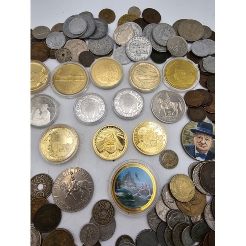 102 - A collection of mixed world coins to include, USA, Germany, France, UK and Commonwealth and others a... 