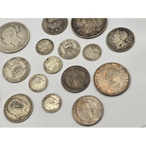 73 - A collection of British Silver Coinage to include a George III 1816 'Bull Head' Shilling, Victoria 1... 