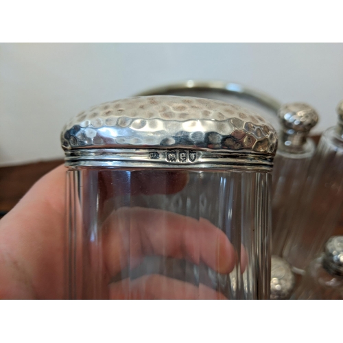 464 - An EPNS rimmed bowl and eight glass jars, all with silver cups/lids Location: LWB
If there is no con... 