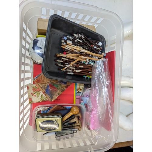 468 - A quantity of wooden and plastic lace bobbins with vintage sewing related items together with 2 mane... 