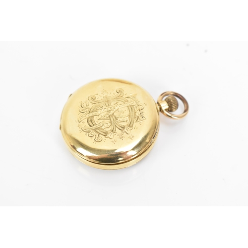 11 - An early 20th century 18ct gold, open face, keyless wound fob watch, the gilt dial having a floral e... 