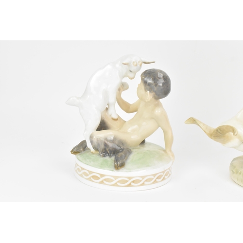 143 - Two Royal Copenhagen porcelain figures to include Faun riding on a goat, no. 737, 20cm high x 21cm w... 