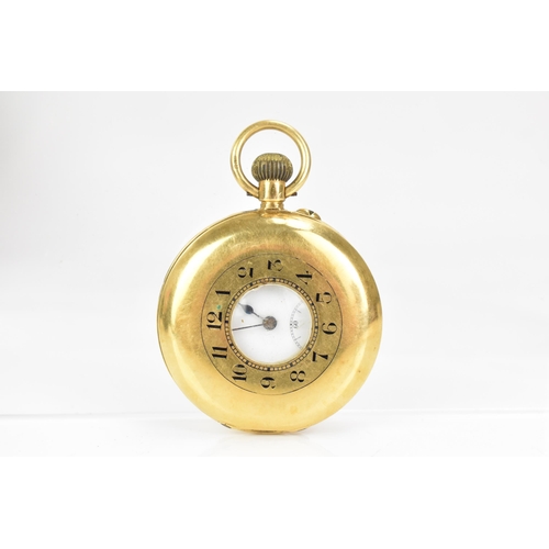 15 - An early 20th century 18ct gold, half hunter. keyless wound pocket watch, the white enamel dial havi... 