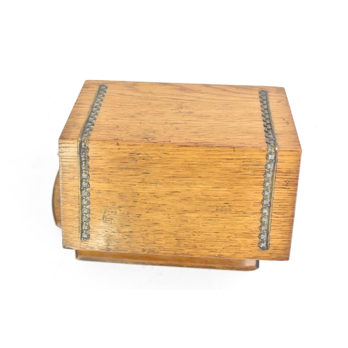 159 - An early 20th century oak novelty cigar and music box, in the form of a kennel with patinated metal ... 