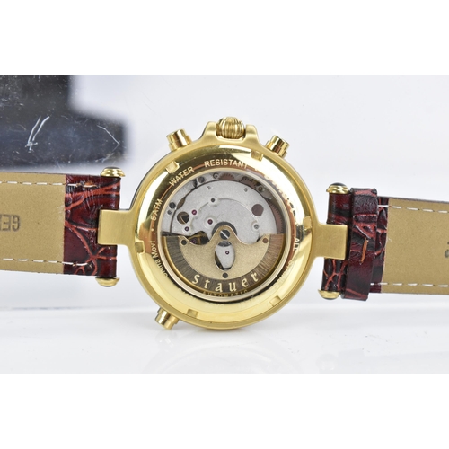 16 - A Stauer Graves, automatic, gents, gold plated stainless steel wristwatch, the dial having four subs... 