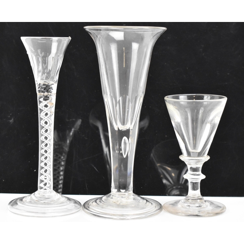 182 - Three glasses to include a George III ale flute 17.8cm high, a George III air twist cordial glass 16... 