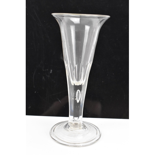 182 - Three glasses to include a George III ale flute 17.8cm high, a George III air twist cordial glass 16... 