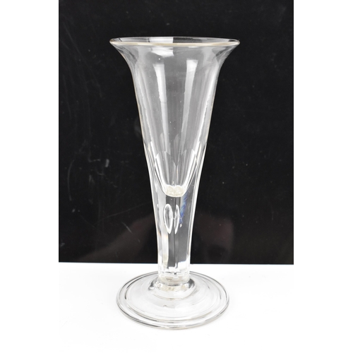 182 - Three glasses to include a George III ale flute 17.8cm high, a George III air twist cordial glass 16... 