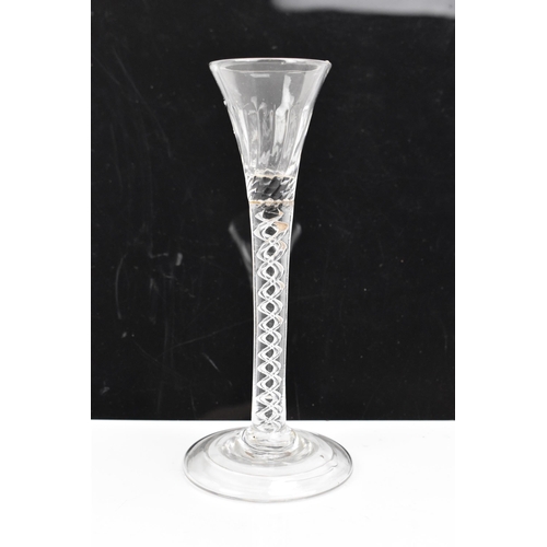 182 - Three glasses to include a George III ale flute 17.8cm high, a George III air twist cordial glass 16... 