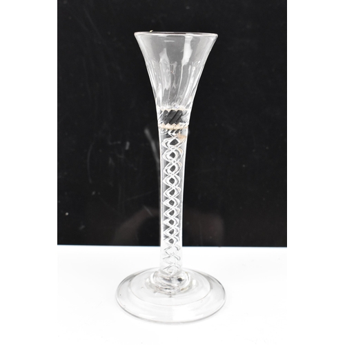 182 - Three glasses to include a George III ale flute 17.8cm high, a George III air twist cordial glass 16... 