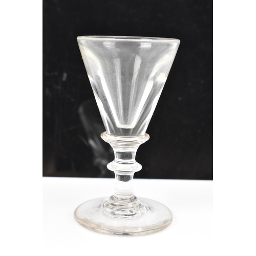 182 - Three glasses to include a George III ale flute 17.8cm high, a George III air twist cordial glass 16... 