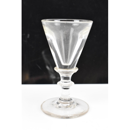 182 - Three glasses to include a George III ale flute 17.8cm high, a George III air twist cordial glass 16... 