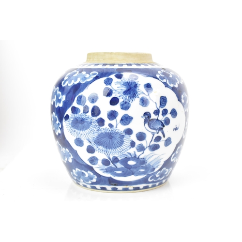 183 - A Chinese late Qing dynasty blue and white ginger jar, late 19th century, painted with a dragon amon... 