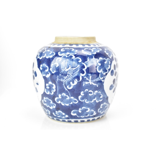 183 - A Chinese late Qing dynasty blue and white ginger jar, late 19th century, painted with a dragon amon... 