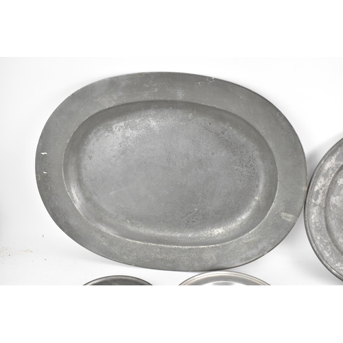 188 - A collection of 18th/19th century pewter plates to include a circa 1760 serving dish by Henry Applet... 