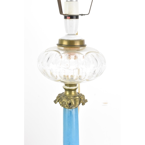 189 - A Victorian gilt brass mounted blue opaline glass table lamp, converted from an oil lamp, having a c... 