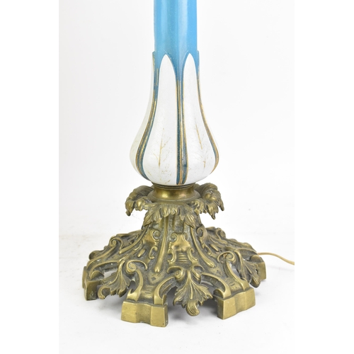 189 - A Victorian gilt brass mounted blue opaline glass table lamp, converted from an oil lamp, having a c... 