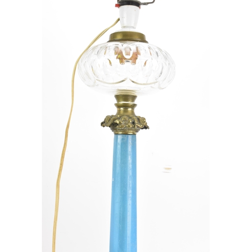 189 - A Victorian gilt brass mounted blue opaline glass table lamp, converted from an oil lamp, having a c... 