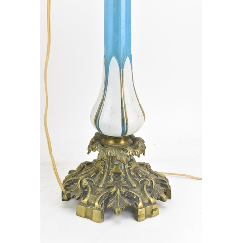 189 - A Victorian gilt brass mounted blue opaline glass table lamp, converted from an oil lamp, having a c... 